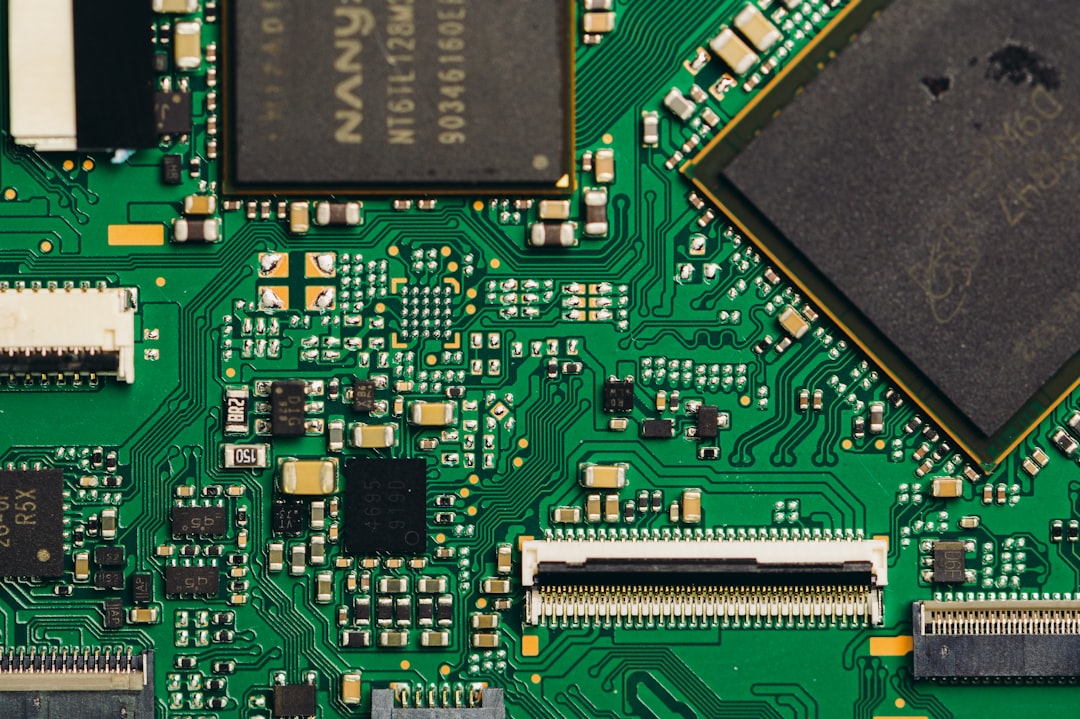 Close-up view of a green circuit board with components.